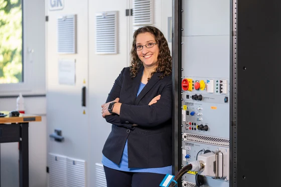 A comemso colleague alongside the test systems at our site.